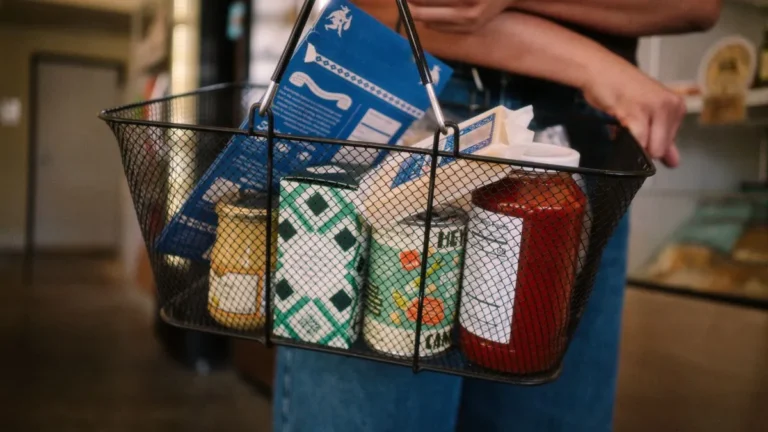 Person using an EBT card to pay for fresh produce at a grocery store