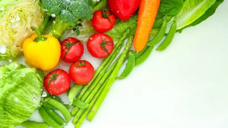 Basket of frugal budget-friendly foods including beans, rice, eggs, and vegetables